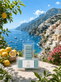 A packaged bar of a wax melt product labeled 'Amalfi Coast' is displayed in front of a scenic coastal landscape with blue sea, mountains, and lemon trees. The product itself is pale mint green and sits on a stone surface with lemons and flowers around it.