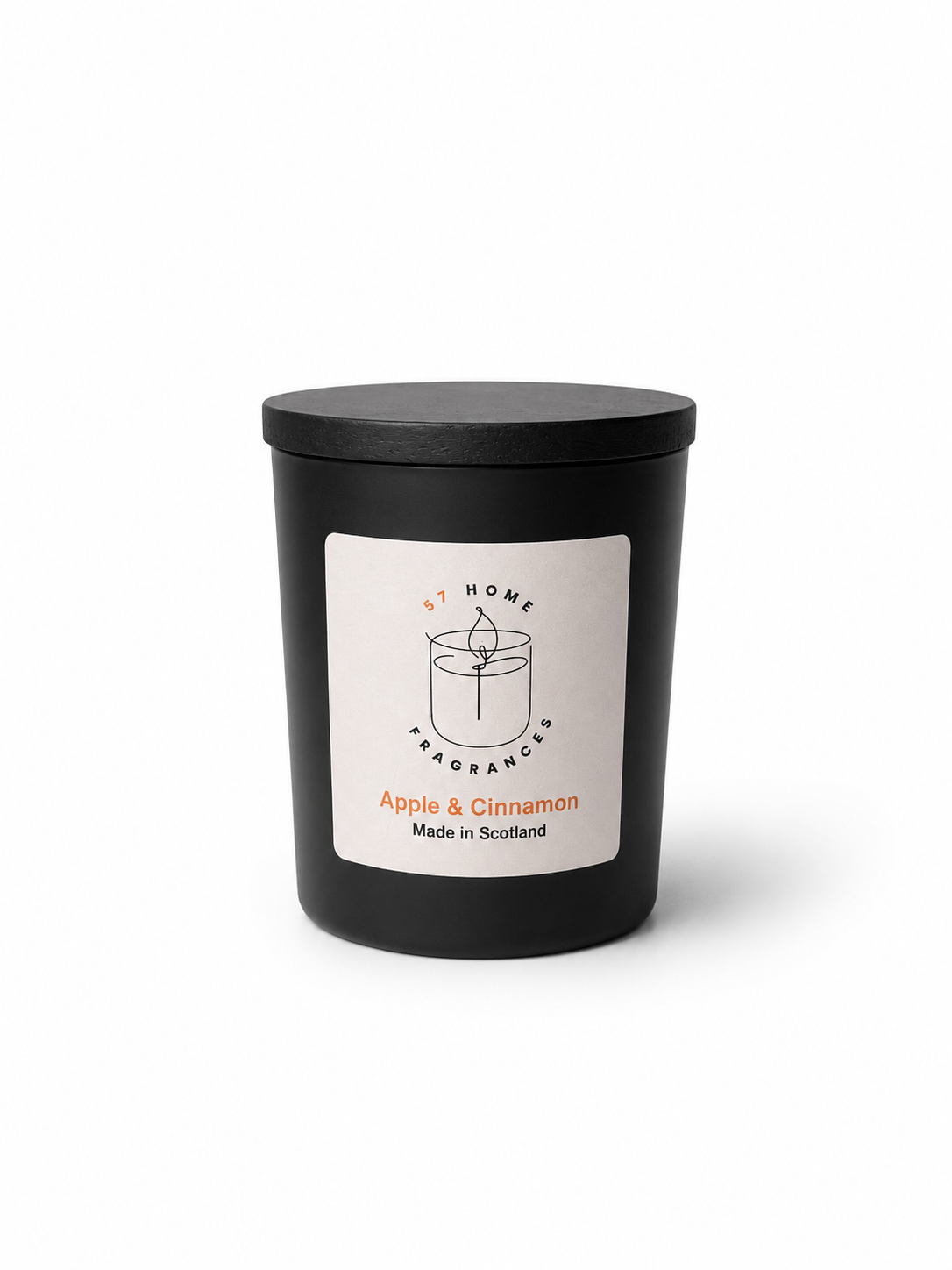 Apple & Cinnamon candle in a black jar with a white label and black wooden jar topper on a white background