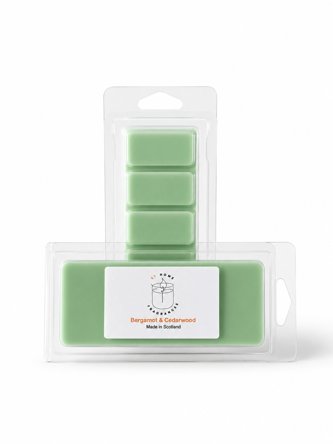 A package of wax melts in clear plastic clamshell packaging, showing a front label reading 'Bergamot & Cedarwood' and a back insert with four rectangular wax blocks in a light mint green color, on a white background.