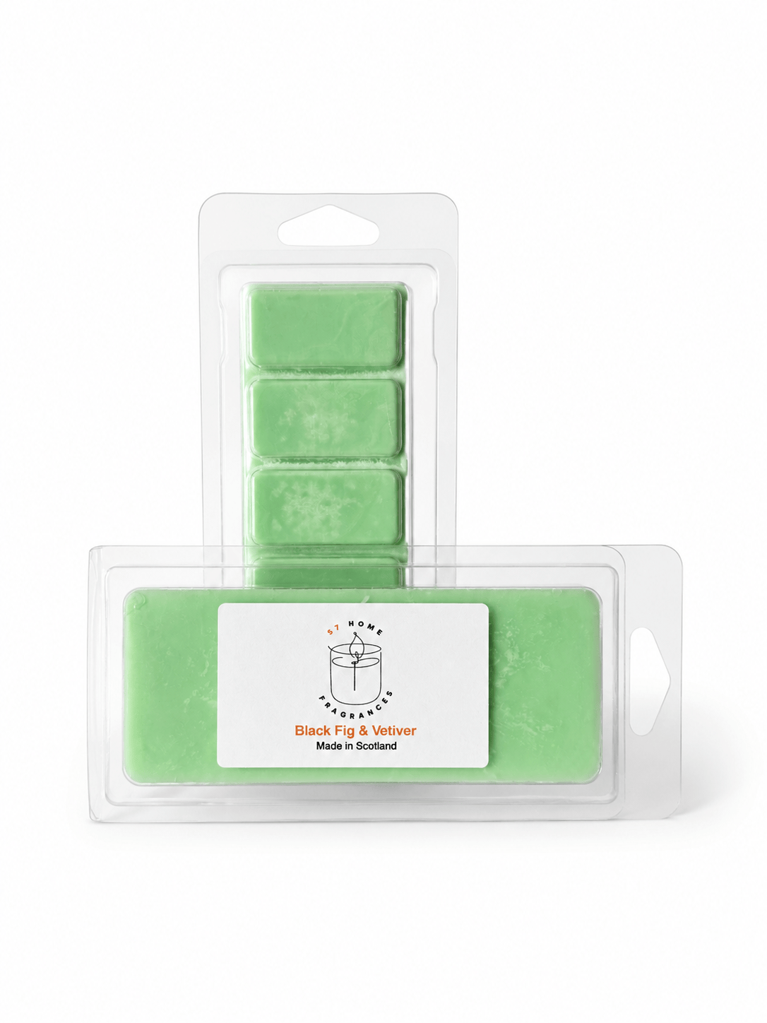 Two packaged green wax melts in clear plastic clamshell packaging on a white background. The front package has a white label reading 'Black Fig & Vetiver' and 'Made in Scotland' with a small illustrated candle graphic.
