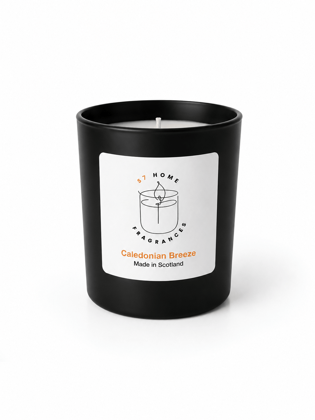 A black glass jar candle with a white label reading 'S7 Home Fragrance' and 'Caledonian Breeze Made in Scotland' on a clean white background.
