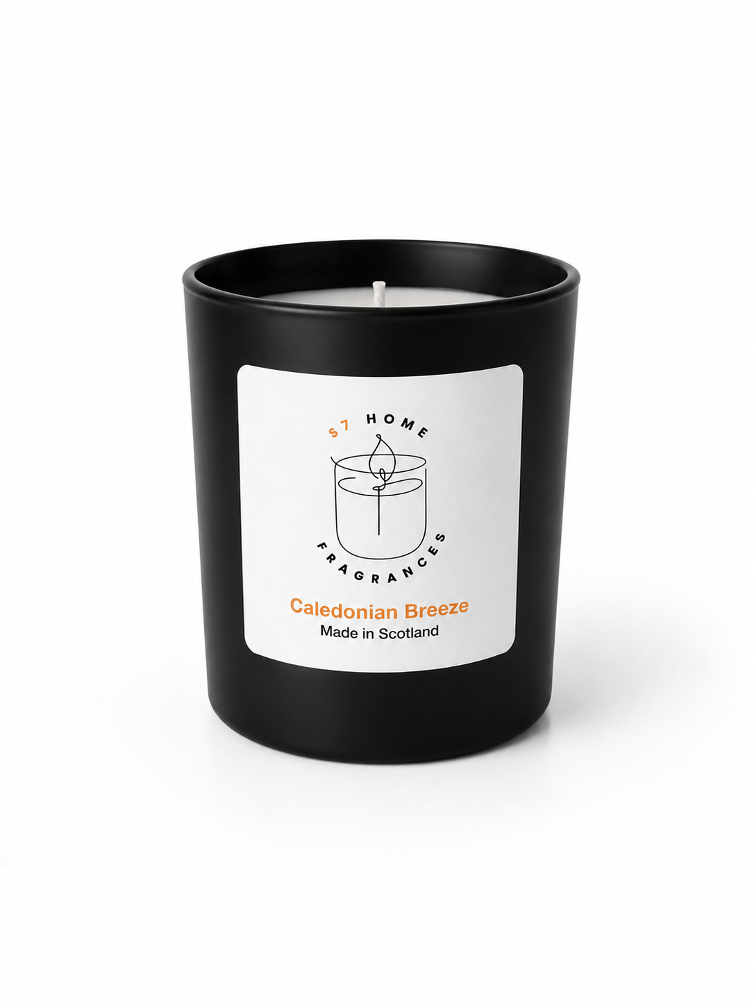 A black glass jar candle with a white label reading 'S7 Home Fragrance' and 'Caledonian Breeze Made in Scotland' on a clean white background.