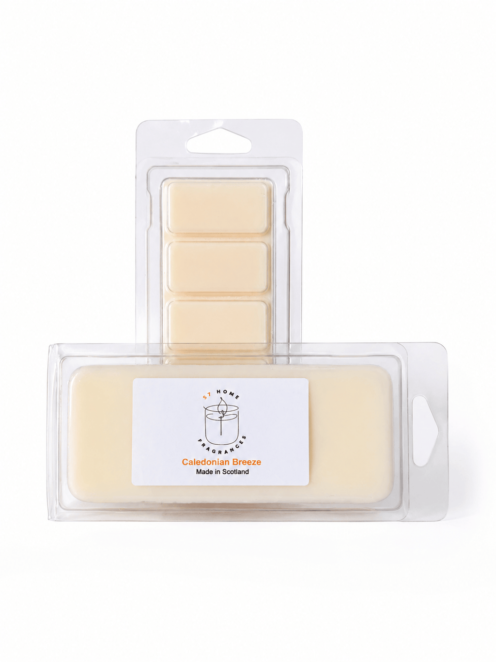 Two wax melts packages on a white background: a smaller clear blister pack with five pale cream wax blocks behind, and a larger clear package in front containing a single pale cream wax block with a white label reading 'Caledonian Breeze' and 'Made in Scotland'.