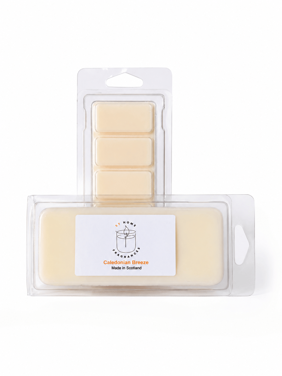 Two wax melts packages on a white background: a smaller clear blister pack with five pale cream wax blocks behind, and a larger clear package in front containing a single pale cream wax block with a white label reading 'Caledonian Breeze' and 'Made in Scotland'.