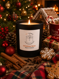 Candle labeled 'Christmas Spice' surrounded by festive decorations including a Christmas tree, gingerbread house, and cookies.