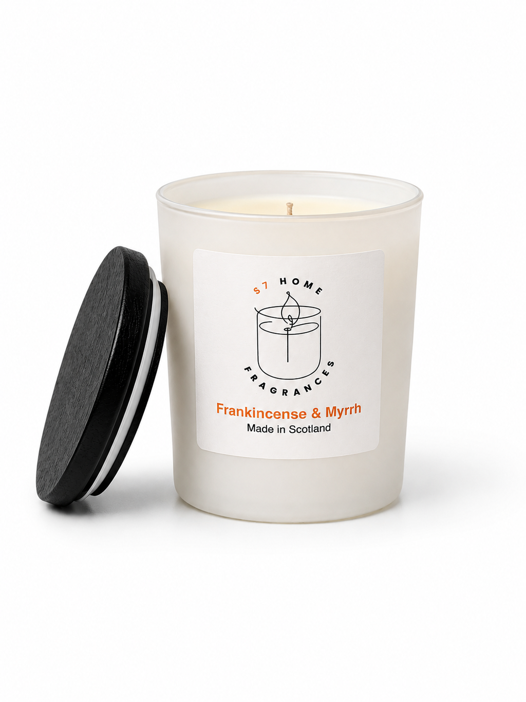 Frankincense & Myrrh candle in a white glass jar with a black wooden jar topper on a white background, featuring a label with branding and product details.