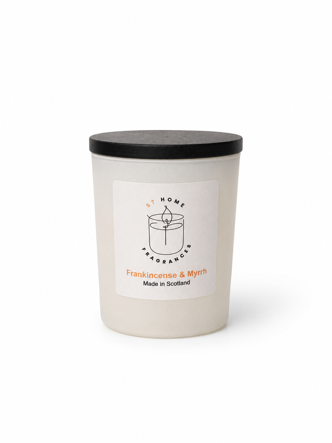 Frankincense & Myrrh candle in a white glass jar with a black wooden jar topper on a white background, featuring a label with branding and product details.
