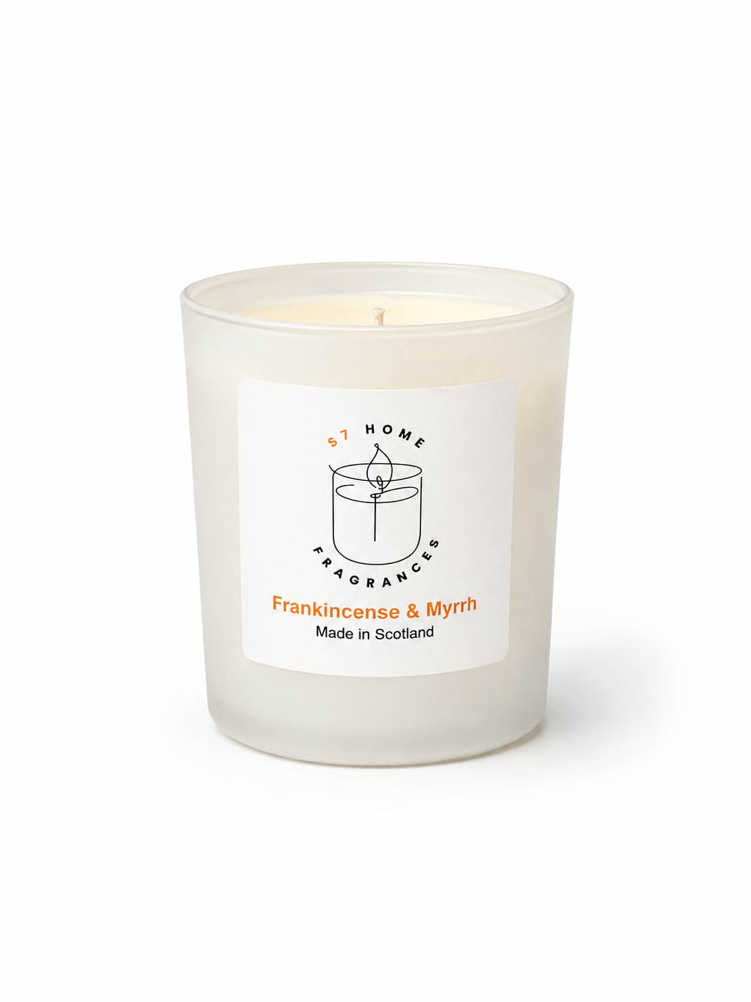 Frankincense & Myrrh candle in a white glass jar on a white background, featuring a label with branding and product details.