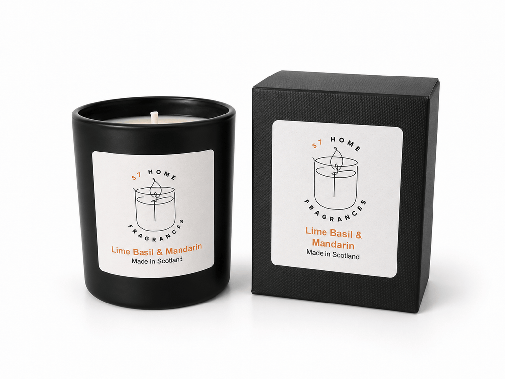 A black glass jar candle with a white label next to its black textured gift box, both labeled 'S7 Home Fragrances' and 'Lime Basil & Mandarin'.