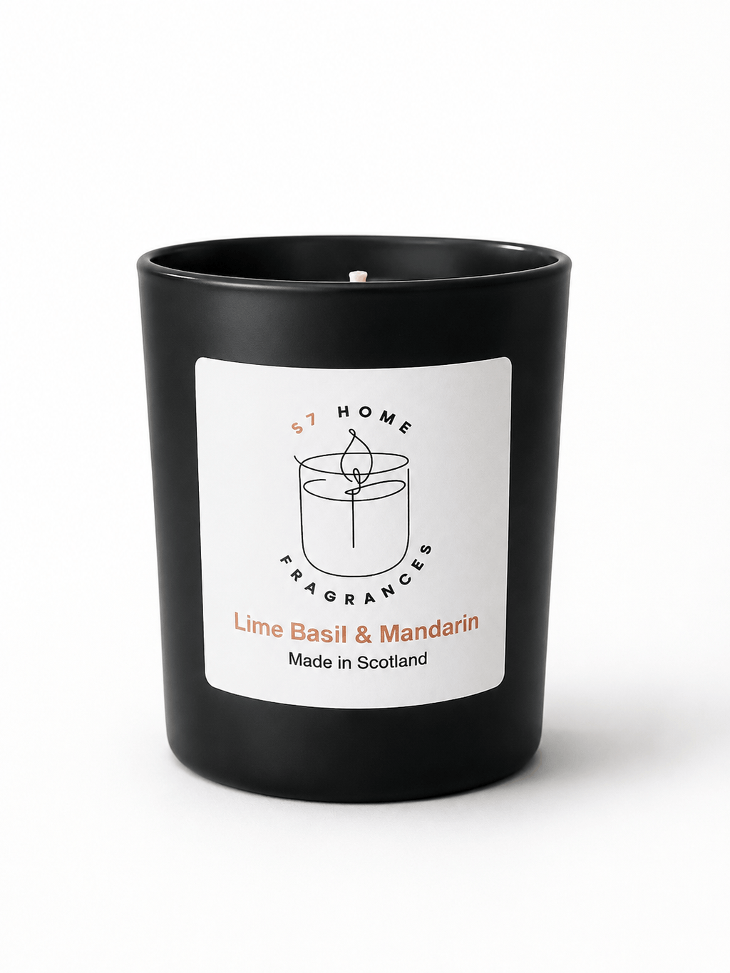 A matte black candle jar with a white front label reading 'S7 HOME FRAGRANCES' and 'Lime Basil & Mandarin Made in Scotland'.