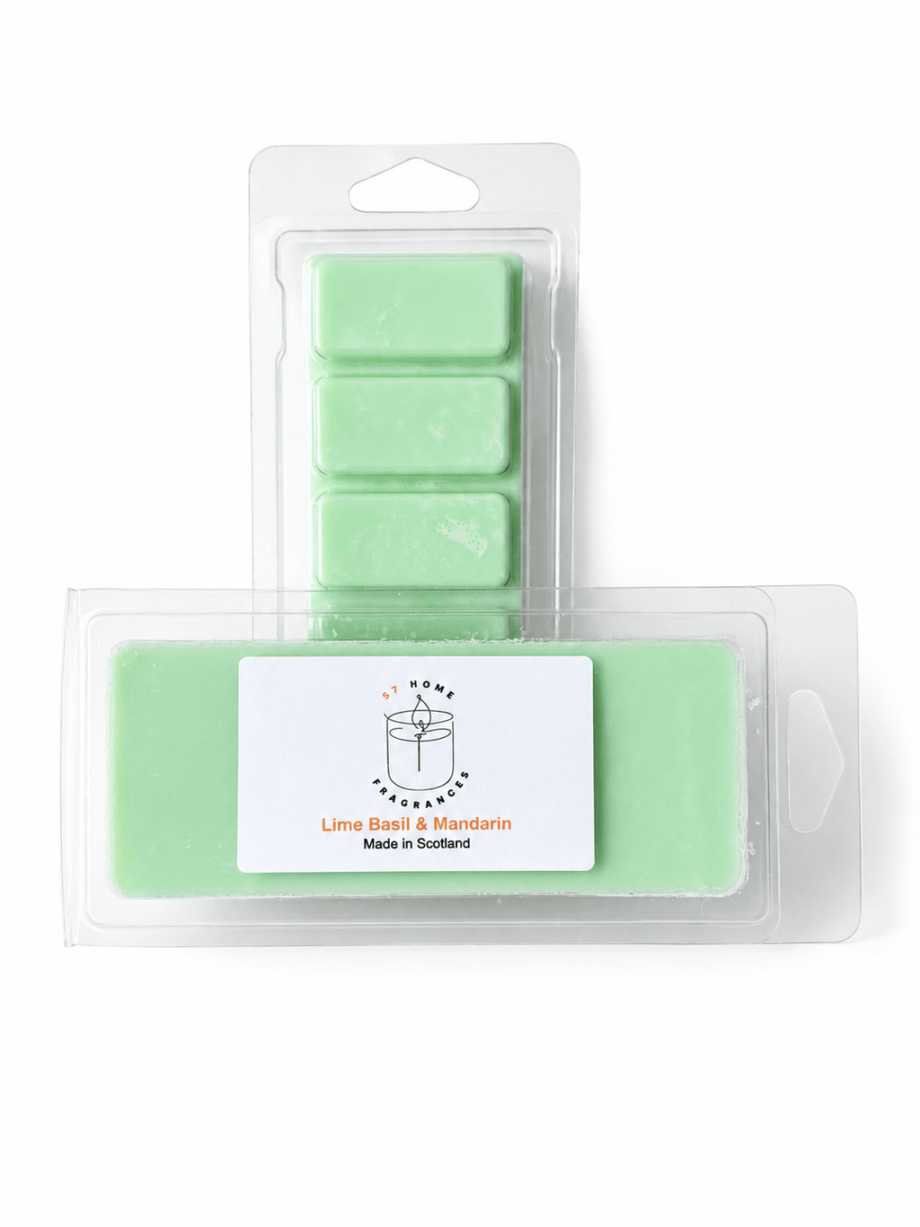 A package of lime scent wax melts in a clear plastic clamshell with a white label reading 'Lime Basil & Mandarin' and  'Made in Scotland,' shown in front of a smaller package of fivematching wax melts on a white background.