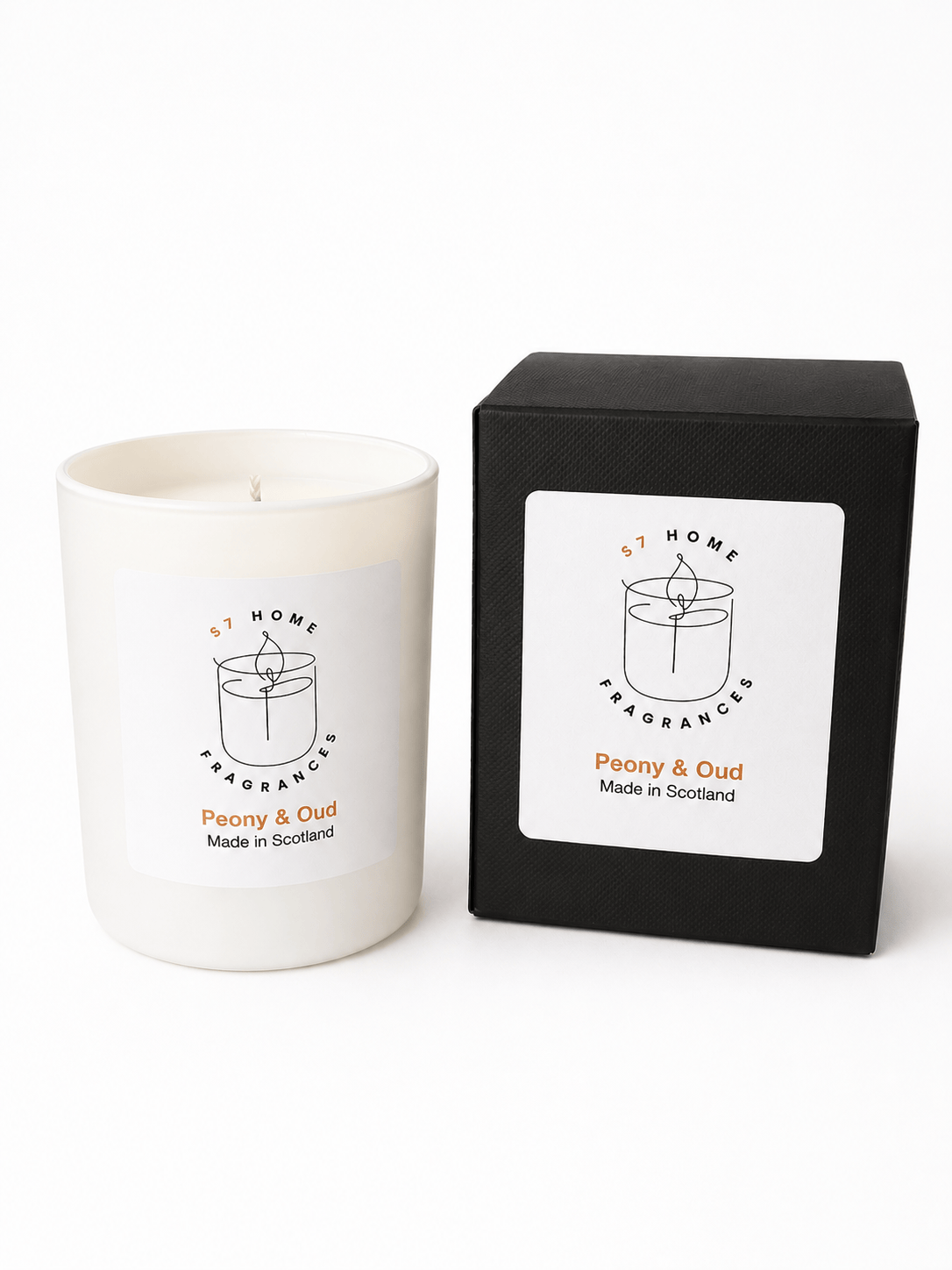 A white scented candle in a matte white glass vessel sits next to its black packaging box. Both feature a white label with a minimalist black line drawing of a candle and the text 'S7 HOME FRAGRANCES' and 'Peony & Oud Made in Scotland'.