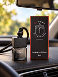 S7 Home Fragrances Hanging Car Diffuser on a car interior dashboard next to a gift box.