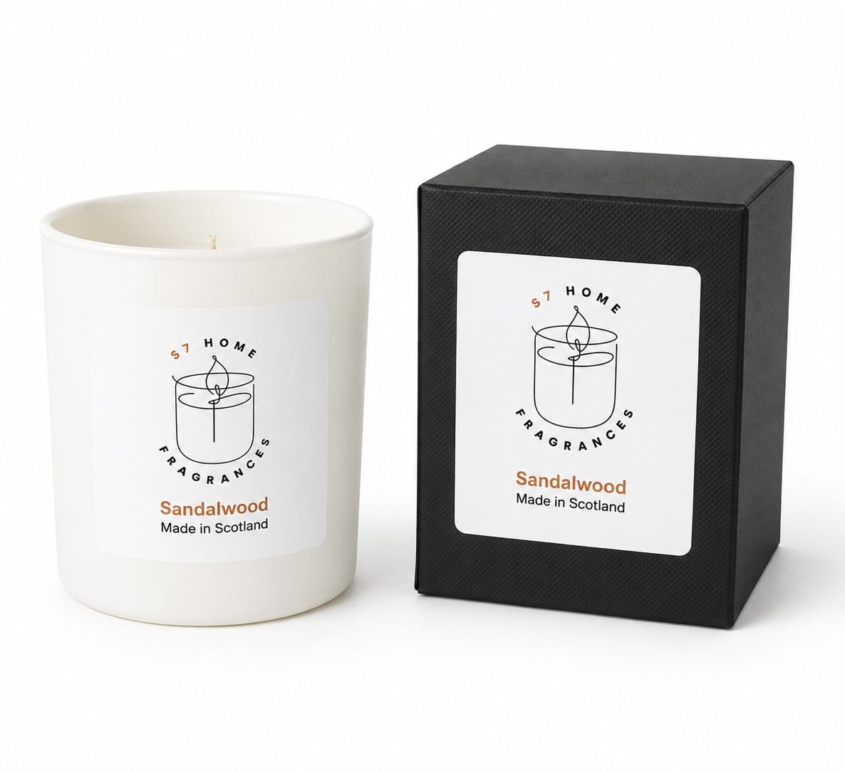 A white wax candle in a white glass vessel next to its black textured packaging box, both featuring a white label with the brand 'S7 Home Fragrances' and scent name 'Sandalwood'.