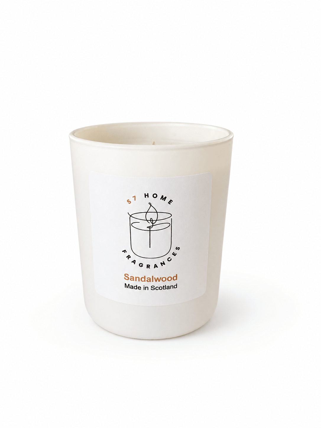 A white glass jar candle with a white label reading 'S7 HOME FRAGRANCES' and 'Sandalwood Made in Scotland'.