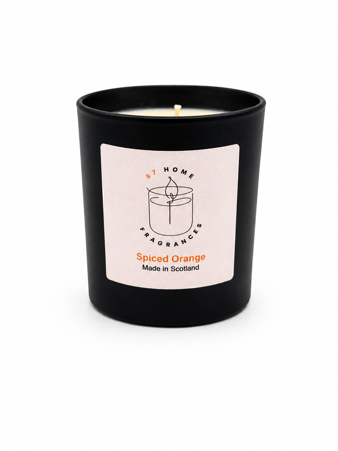Spiced Orange candle in black jar with a white label on a white background